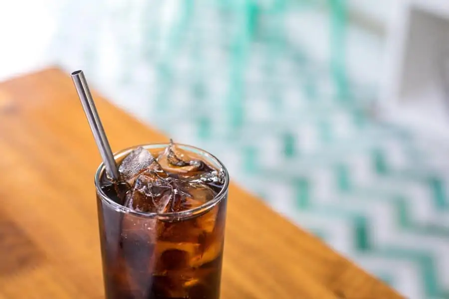 cola on ice with straw