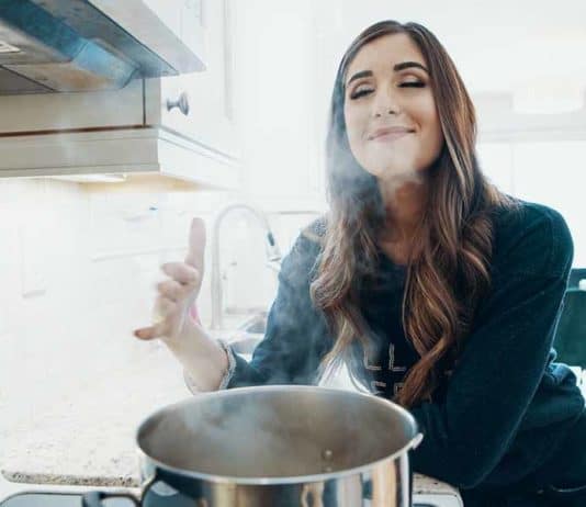 How To Clean A Self-Cleaning Oven: 7 Kitchen Cleaning Tips Melissa Maker at the stove with a pot