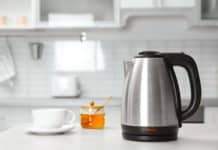 How to Clean An Electric Kettle and Stovetop Kettle Electric kettle sitting on kitchen counter