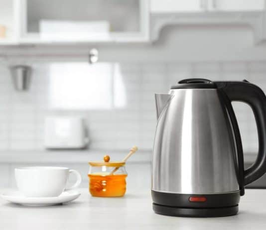 How to Clean An Electric Kettle and Stovetop Kettle Electric kettle sitting on kitchen counter