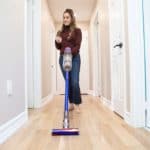 Which Dyson Vacuum Should You Buy? Melissa vacuuming her hallway