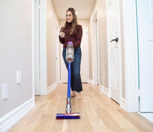 Which Dyson Vacuum Should You Buy? Melissa vacuuming her hallway