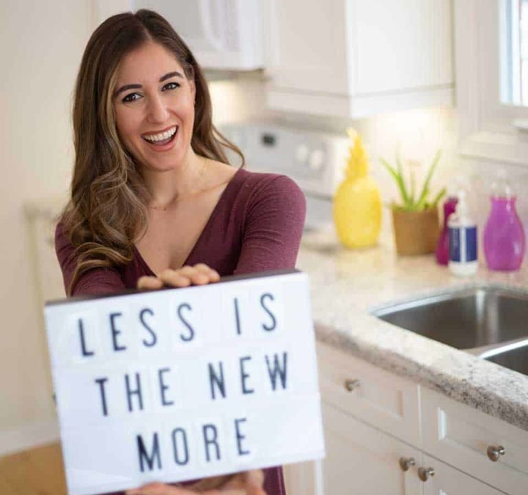 Melissa holding a sign: Less is the New More