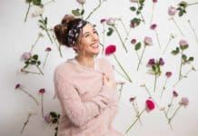 DIY Body Butter Recipe: Natural Skin Care Melissa Maker sitting in front of a wall of flowers