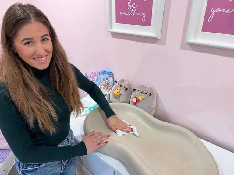 Melissa cleaning a baby changing table