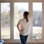 How to Clean Window Sills (Quick, Easy, & Cheap) Melissa Maker standing at window