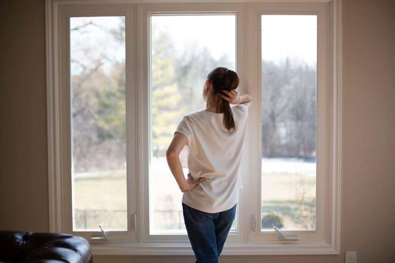 Melissa Maker standing at window