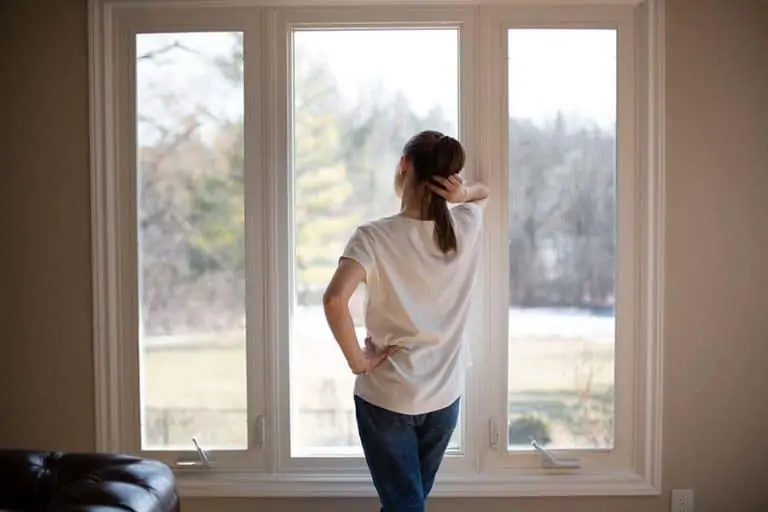 Melissa Maker standing at window