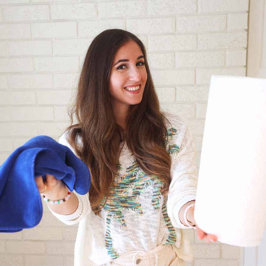 Melissa holding paper towel and microfiber cloth