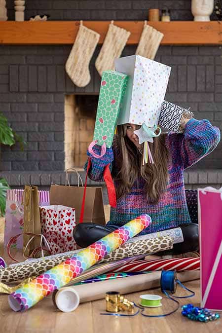 Melissa Maker with wrapping paper and boxes