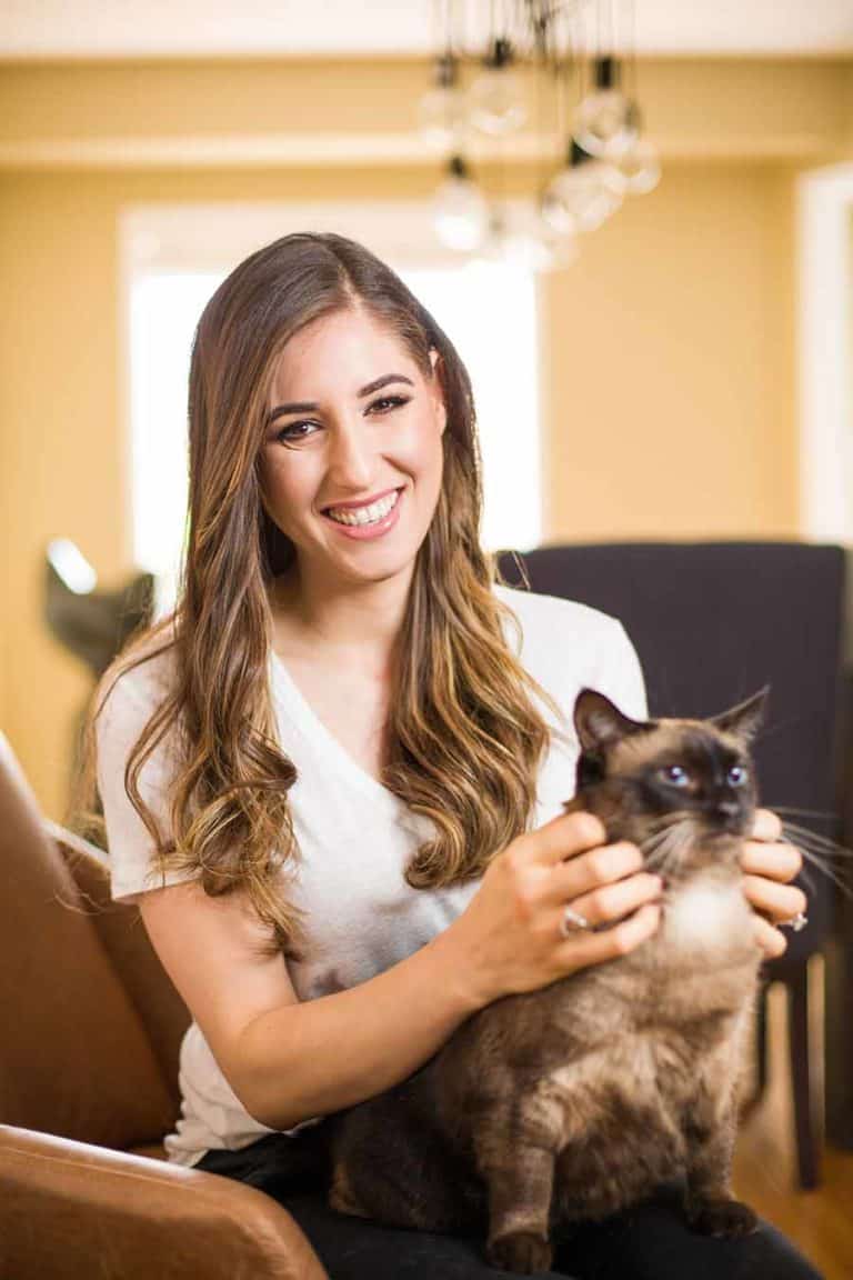 Melissa Maker sitting with her cat