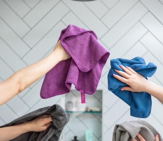 27 Ways to Use Microfiber Cloths Hands holding microfiber cloths