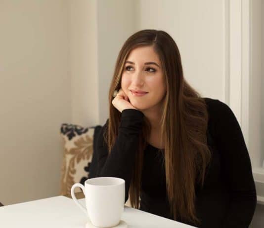 Cleaning A Keurig Coffee Maker Melissa with cup of coffee