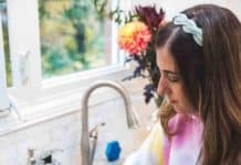 How to Clean A Burnt Pot or Pan: Cleaning Hacks Melissa Maker scrubbing a pan with a sponge