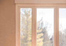 How to Clean Hardwood Floors Without Streaks! Melissa in a dress cleaning the floor