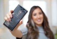 How To Clean A Clear Phone Case Melissa Maker holding a phone