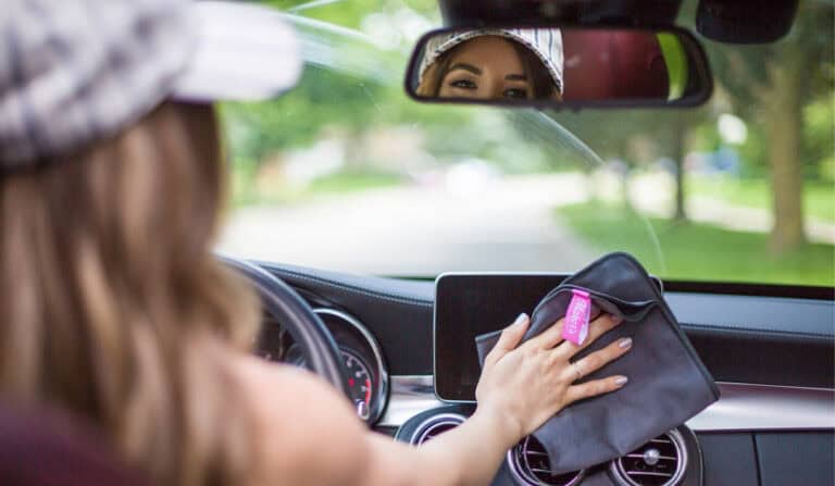 melissa maker looking in rear-view mirror